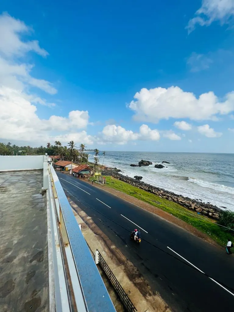 Ocean and coast road seen from the rooftop terrace