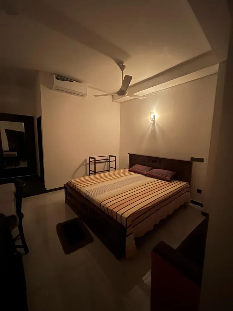Air conditioned double room photographed at night