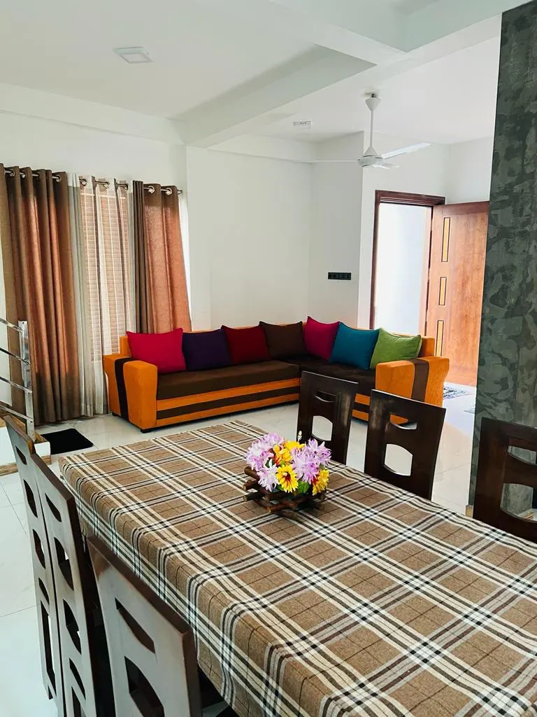 Shared dining area beside the colourful guest lounge